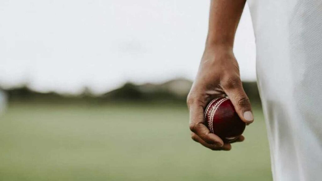 cricket player holding leather ball scaled e1647959785912 980x551 1